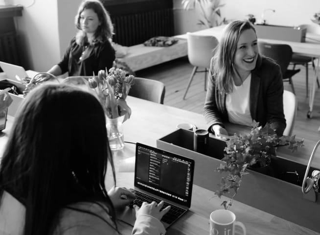 A group of women working together in an office.